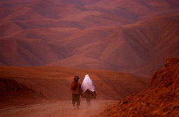 A couple went down the barren roads of Badakhshan province, North Afghanistan, 2001