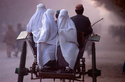 Women were driven in a buggy in the liberated city of Taloquan, North Afghanistan, November 2001