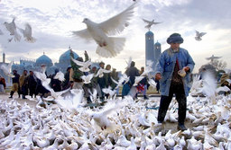 A man fed the doves of the Hazrat Ali shrine, Mazar–i–Sharif, North Afghanistan, November 2001