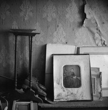 In the attic of the Chateau de Maillebois old portraits stood next to an ancient pair of skates